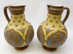 Pair Mettlach stoneware baluster form jugs,