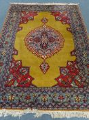 Persian gold ground rug, central medallion, repeating border,