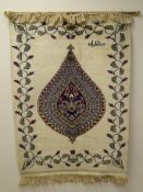 Persian wool wall hanging, central bulb medallion on an ivory ground with leaf border, 93cm x 67cm,