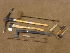 A quantity of hand tools comprising of axes, a sledge hammer,