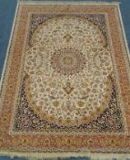 Persian style beige ground rug, central medallion, repeating border,