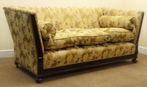 Early 20th century mahogany framed three seat sofa, scrolled arms, turned supports on castors,