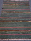 Kilim green ground rug, striped field,