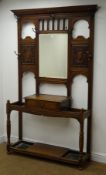 Edwardian oak hallstand, two floral carved panels flanking bevel edge mirror above single drawer,