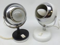 Two 1960s/ 70's 'Eyeball' adjustable desk lamps in black and white with chrome mounts,