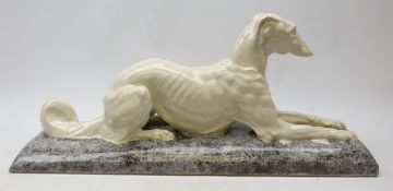 After Louis-Henri Nicot (French 1878-1944): crackle glaze sculpture 'Lying Greyhound' for André Fau