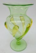 Early 20th century green pedestal glass vase with yellow tears,