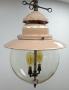 Pink enamel industrial pendant light fitting, two branch with clear glass globular shade,