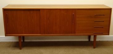 Nils Jonson teak sideboard, four drawers, two sliding cupboard doors, turned tapering supports,