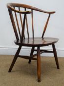 Ercol medium elm cow horn armchair, stick back, turned supports joined by stretcher,