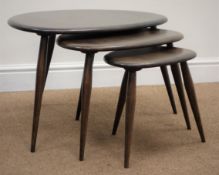 Nest three Ercol style pebble tables, W65cm, H40cm,