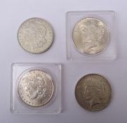 United States of America Morgan Dollars dated 1884 O mintmark and 1921 no mintmark and two Peace