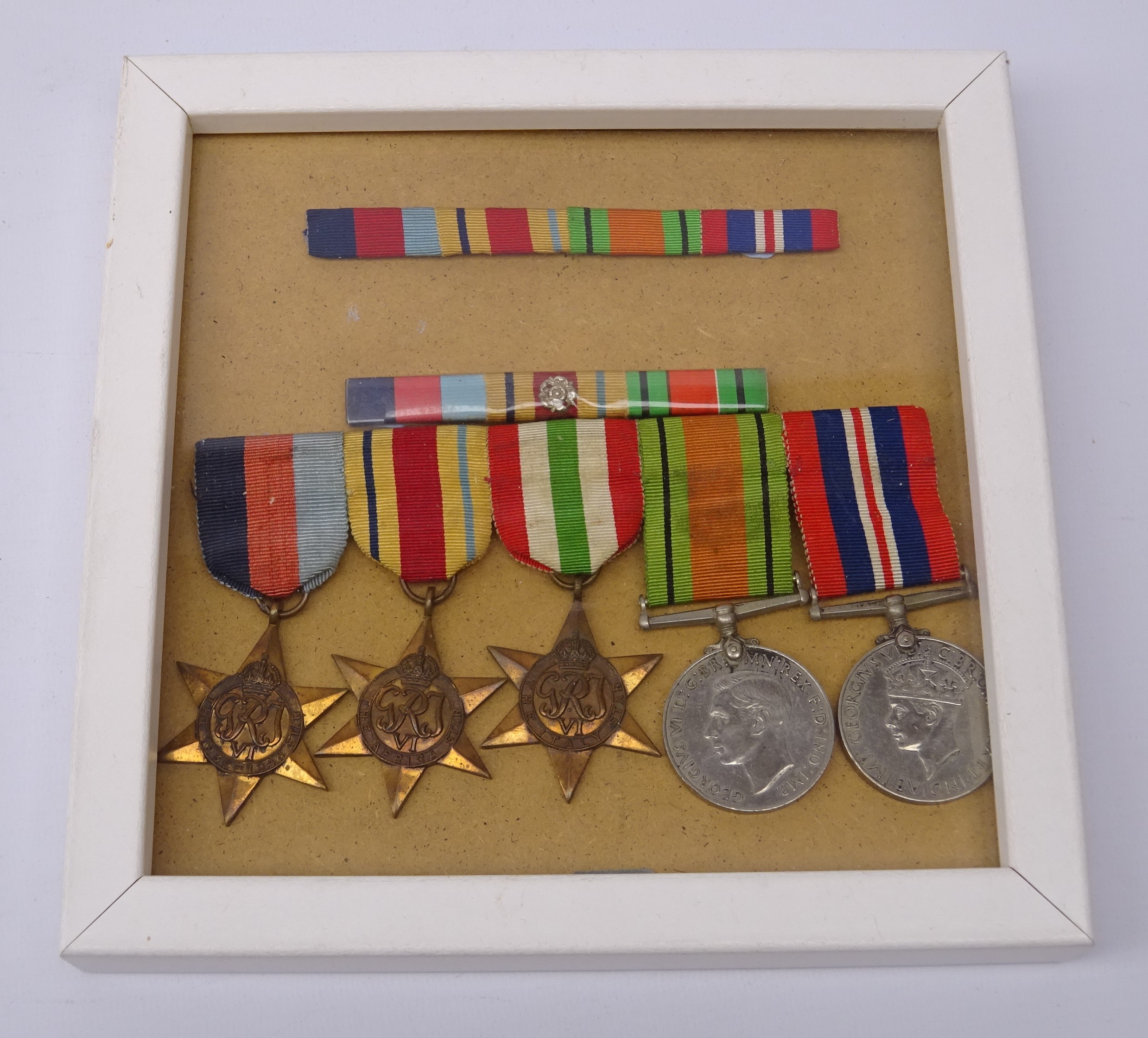 Five WW2 medals comprising 1939-45 medal, Defence Medal, Africa Star, Italy Star and 1939-45 Star,