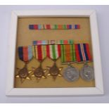 Five WW2 medals comprising 1939-45 medal, Defence Medal, Africa Star, Italy Star and 1939-45 Star,