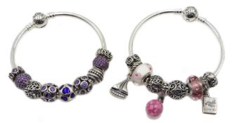 Two silver Pandora charm bracelets, with eighteen Pandora charms total,