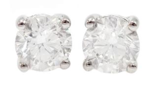 Pair of 18ct white gold diamond stud earrings, stamped 750, diamond total weight 2.