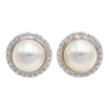 Pair of 18ct white gold mabe pearl and diamond stud earrings,