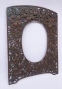 Japanese Meiji patinated metal frame, pierced surround cast with grape vines & quail amongst millet,