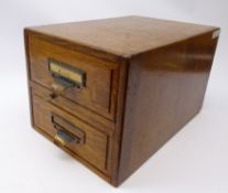 Early 20th century Shannon oak two drawer filing cabinet, patinated copper pull handles and lock,