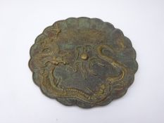 Chinese bronze plate, relief cast with Dragon chasing the flaming pearl, incised script to base,