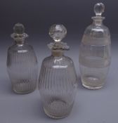 Pair Georgian glass spirit decanters with fluted cut banding, engraved Brandy and Rum,