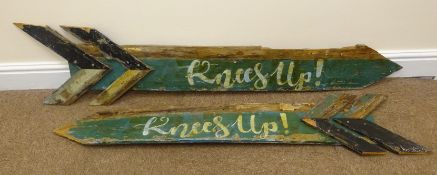 Pair painted arrow 'Knees Up' event signs,