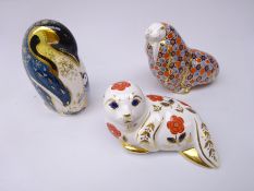 Three Royal Crown Derby paperweights: Penguin and Chick dated 1998, gold stopper, Walrus dated 1987,