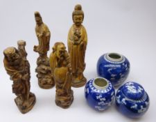 Four carved hardwood oriental figures, H41cm three Chinese Prunus pattern ginger jars,