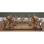 19th century softwood carved, wrought metal scrolled cresting rail, flanked by four candle holders,