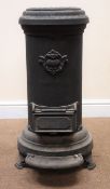 Cast iron cylindrical heating stove, top loading, lift up ashbox door,