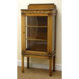 Early 20th century narrow oak display cabinet, raised back, moulded top,