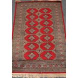 Bokhara red ground rug, repeating border,