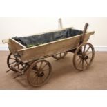 Early 20th century pitch pine dog cart, four metal bound wheels,