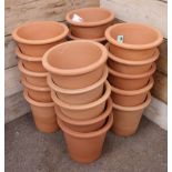 Twenty circular tapering terracotta flower pots, D34cm,