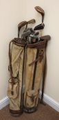 Two vintage golf bags containing various vintage clubs Condition Report <a