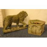 Stone model of Lion with paw on ball, plinth base (W72cm, H56cm,