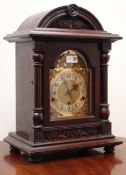 Edwardian stained carved arched top bracket clock with brass Arabic dial and bevelled glass door