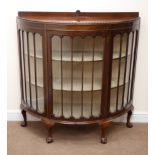 Early 20th century mahogany demi-lune display cabinet, raised back with shell carving,