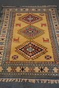 Turkish blue ground rug, geometric pattern field, repeating border,