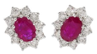 Pair of 18ct white gold ruby and diamond cluster stud earrings, total ruby weight 1.