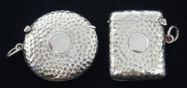 Two Edwardian silver circular and rectangular spot hammered vesta cases by W J Myatt & Co,