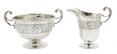 Silver twin handles pedestal dish and matching cream jug, Celtic design by Charles Weale,