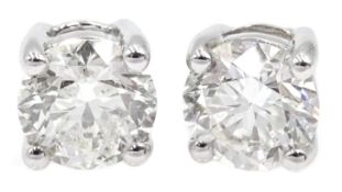 Pair of 18ct white gold diamond stud earrings of approx 1.