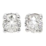 Pair of 18ct white gold diamond stud earrings of approx 1.