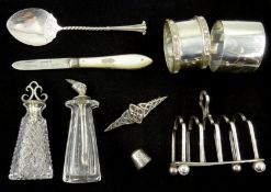 Collection of small hallmarked silver items including miniature toast rack, napkin rings,
