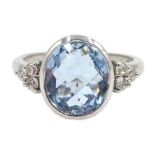 White gold bezel set oval briolette cut aquamarine with round brilliant cut diamond shoulders,