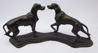 Bronzed model of two Hunting Dogs on shaped cast iron base,