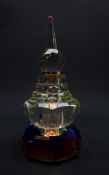 Art Deco style prism glass scent bottle of rounded stepped form,