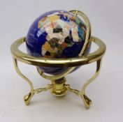 Gemstone inlaid terrestrial globe on polished brass stand,