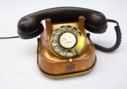 Copper and brass framed telephone with black Bakelite receiver,